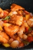 Crispy fried salmon pieces in sweet and sour sauce 